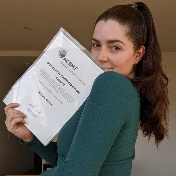 Sarah Belet receiving her certificate in the mail